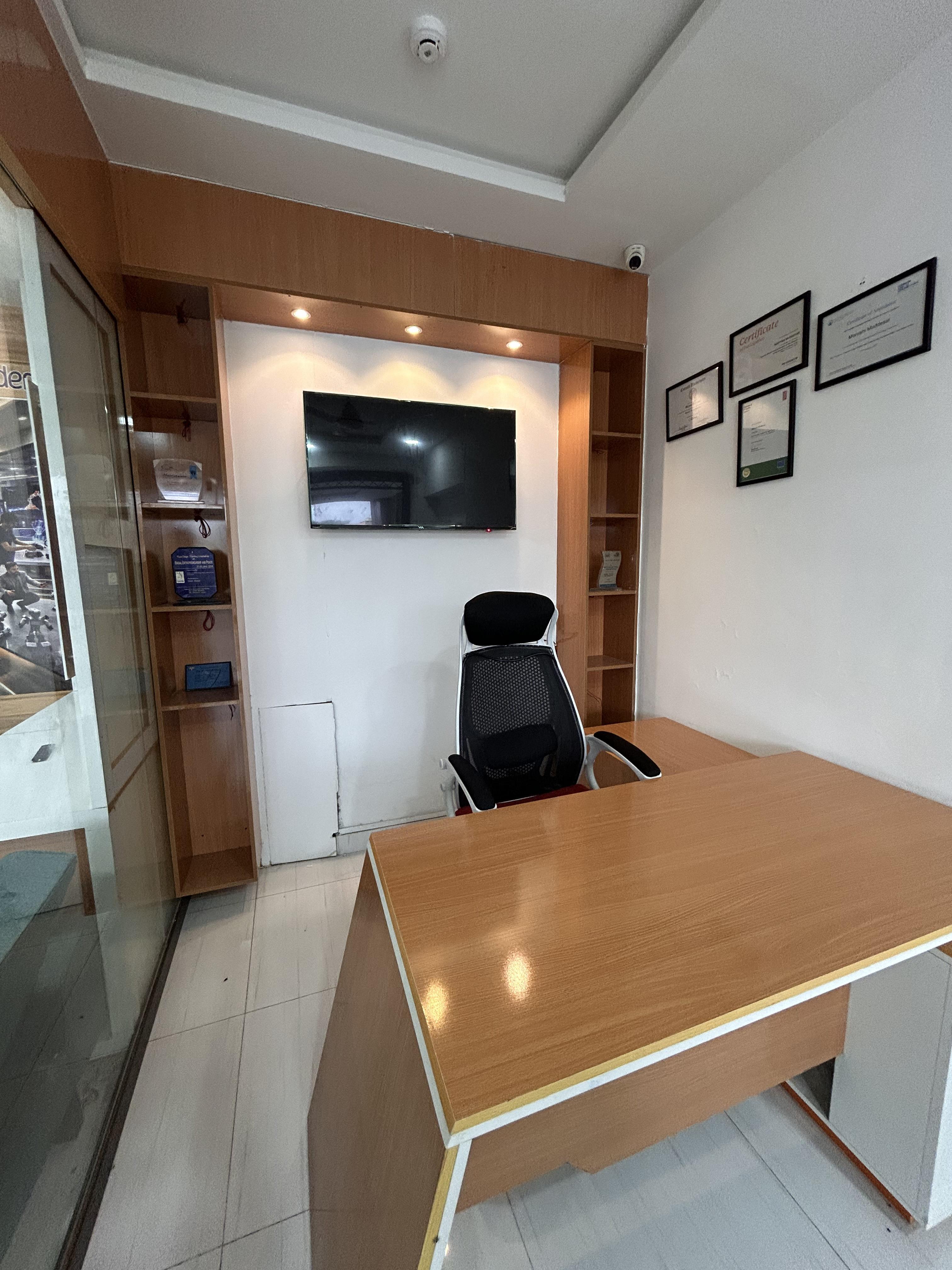 Furnished office with window and professional working setup